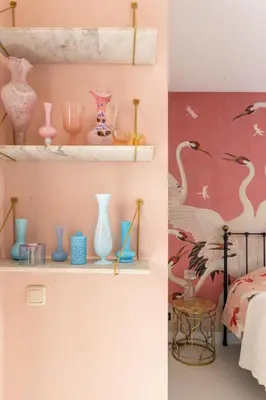 a room with shelves with vases and birds on the wall at Canal house Egelantiersgracht with private garden in Amsterdam