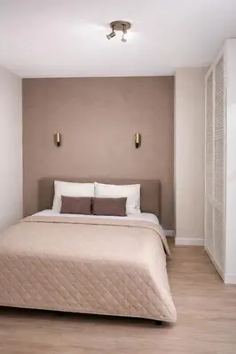 a bedroom with a large bed in a room at Maison Lumière - Private Rooftop terrace in Amsterdam