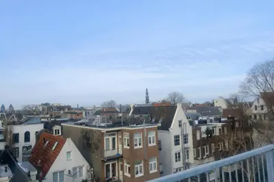a view of a city from a balcony at Maison Lumière - Private Rooftop terrace in Amsterdam