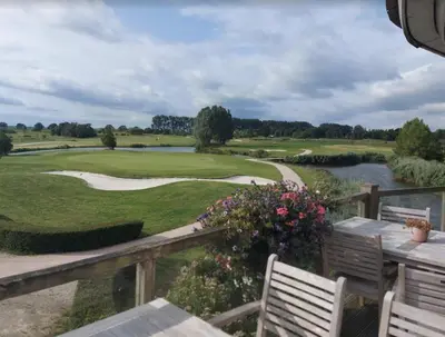 a view of a golf course from a balcony at Herberg De Hollandsche Leeuw in Nieuwkoop