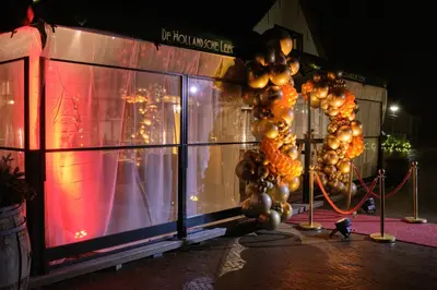 a building with a bunch of balloons on the side of it at Herberg De Hollandsche Leeuw in Nieuwkoop