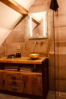 a bathroom with a sink and a glass shower at Herberg De Hollandsche Leeuw in Nieuwkoop