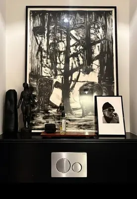 a table with a picture and a picture on it at The Design apartment with canal-view in Amsterdam