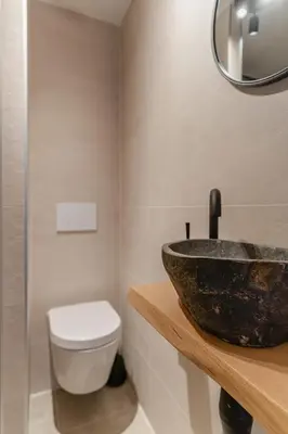 a bathroom with a sink and a toilet at Appartement de Burgemeester - centrum in Castricum