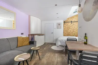 a living room with a couch and a table at 2P studio in Utrecht city center in Utrecht