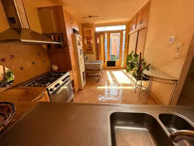 a kitchen with a sink and a stove at C-Home in Utrecht