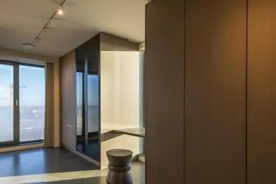 a room with a chair and a large window at Super View Penthouse Deluxe in Amsterdam