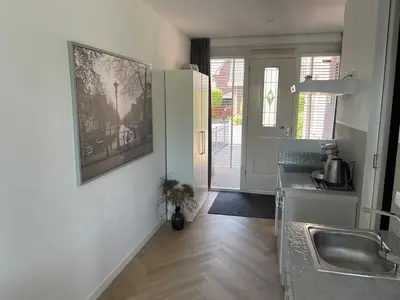 a kitchen with a sink and a counter top at Private apartment with garden, close to Amsterdam in Assendelft