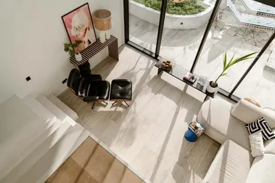 an overhead view of a living room with a couch and chairs at 8 persons Wellness Villa Tulpenacker in Roelofarendsveen