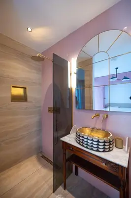 a bathroom with a sink and a mirror at 8 persons Wellness Villa Tulpenacker in Roelofarendsveen