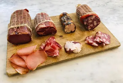 a cutting board with different types of food on it at Pension Homeland in Amsterdam