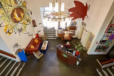 an overhead view of a store with a woman at a counter at Pension Homeland in Amsterdam