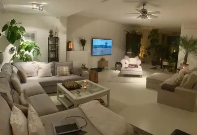 a living room with a couch and a table at Spacious house IJmeer Amsterdam - east IJburg in Amsterdam