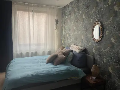 a bedroom with a bed with a mirror on the wall at Spacious house IJmeer Amsterdam - east IJburg in Amsterdam
