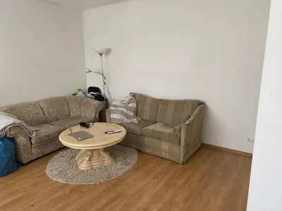 a living room with a couch and a table at Roses in Amstelveen