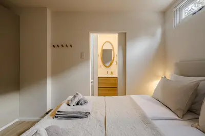 a bedroom with a bed with towels on it at Green Heart Apartment Private Parking in Zandvoort