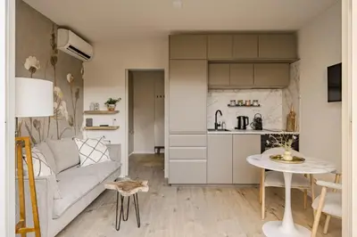 a living room with a couch and a table at Green Heart Apartment Private Parking in Zandvoort