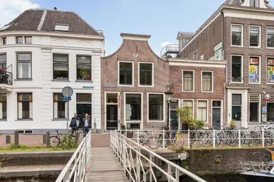 a bridge over a canal in front of buildings at Luxury Spacious Studio in Utrecht City Center in Utrecht