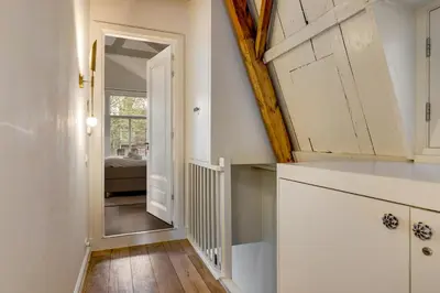a hallway with a door and a mirror in a room at 2 Luxurious Studios in Utrecht City Center in Utrecht