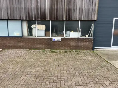 a brick building with a street sign in front of it at Casa Vos Family Home in Zandvoort