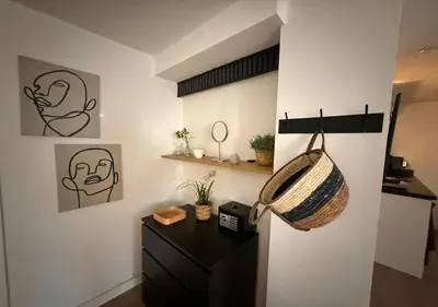 a room with a desk and a basket on a wall at Central Luxe Family Retreat in Amsterdam
