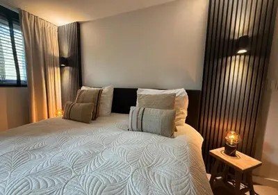a bedroom with a large bed with pillows on it at Central Luxe Family Retreat in Amsterdam