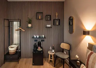 a living room with a black and white striped wall at Central Luxe Family Retreat in Amsterdam