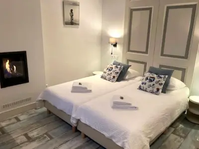 a bedroom with two beds with towels on them at OscarReestratResidence in Amsterdam