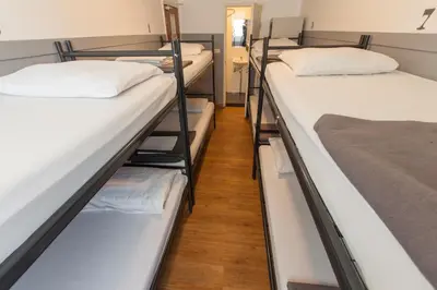 a row of bunk beds in a dorm room at Travel Hotel Amsterdam in Amsterdam