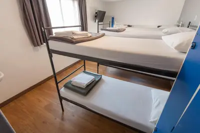 two bunk beds in a room with a mirror at Travel Hotel Amsterdam in Amsterdam