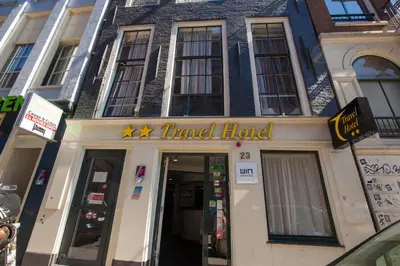 a travel hotel building with a travel hotel sign on it at Travel Hotel Amsterdam in Amsterdam
