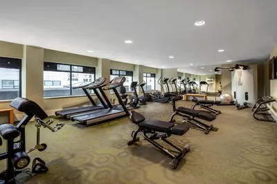 a gym with a bunch of exercise equipment in it at Element Amsterdam in Amsterdam