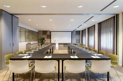 a large conference room with a long table and chairs at Element Amsterdam in Amsterdam