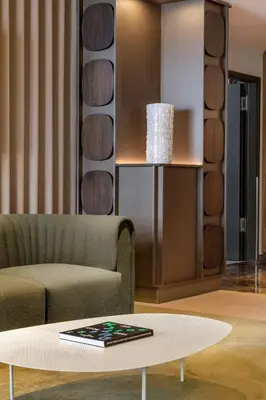 a living room with a couch and a coffee table at Amsterdam Marriott Hotel in Amsterdam