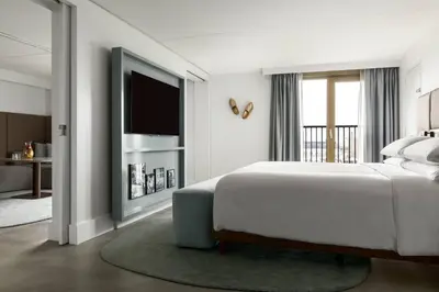 a bedroom with a large bed and a television at Amsterdam Marriott Hotel in Amsterdam