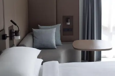 a hotel room with a couch and a table at Amsterdam Marriott Hotel in Amsterdam