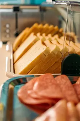 a tray of bread and chips on a table at The Flying Pig Beach Hostel Age 18 to 40 in Noordwijk aan Zee