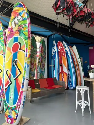 a bunch of surfboards are lined up in a room at Holiday Home Busch en Dam by Interhome in Uitgeest
