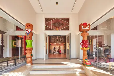 a hallway with several wooden sculptures in a building at Generator Amsterdam in Amsterdam