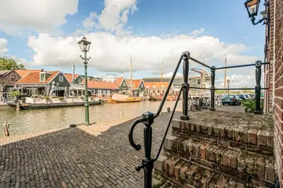 a view of a canal with boats in the water at The Dutch Buoy in Monnickendam