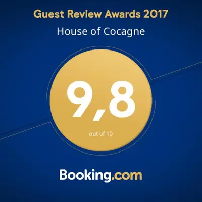 a yellow circle with the words guest review awards house of cocaine at House of Cocagne in Kockengen