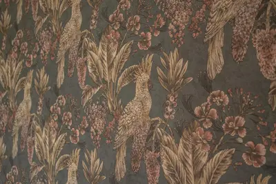 a tapestry with a bird and flowers on a wall at Hotel Beemster in Middenbeemster