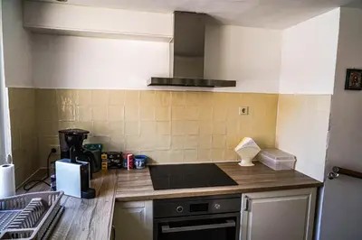 a kitchen with a sink and a stove top oven at The Balcony at Prinsen Canal apartment Amsterdam in Amsterdam