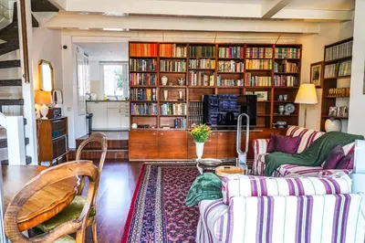 a living room with a couch and a table at The Balcony at Prinsen Canal apartment Amsterdam in Amsterdam