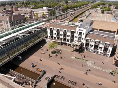 an aerial view of a city with a bridge at JOINN! City Lofts Houten Utrecht in Houten