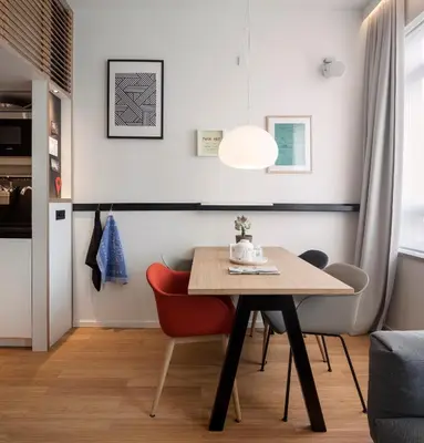 a dining room with a table and chairs at Zoku Amsterdam in Amsterdam