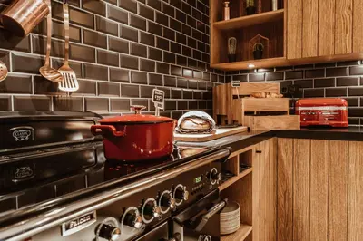 a kitchen with a stove with a pot on it at Mr. Jordaan in Amsterdam