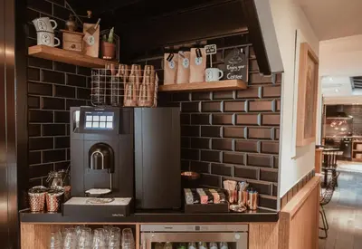 a coffee shop with a brick wall at Mr. Jordaan in Amsterdam