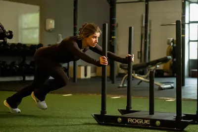 a woman is running on a treadmill in a gym at Hotel & Wellness Zuiver in Amsterdam