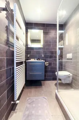 a bathroom with a sink and a toilet and a tub at B&B La Festa in Amsterdam